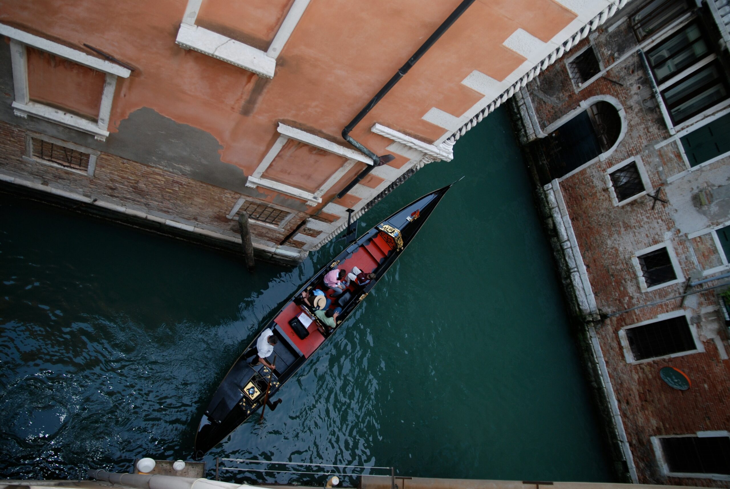 A damaged motorboat being towed after a storm