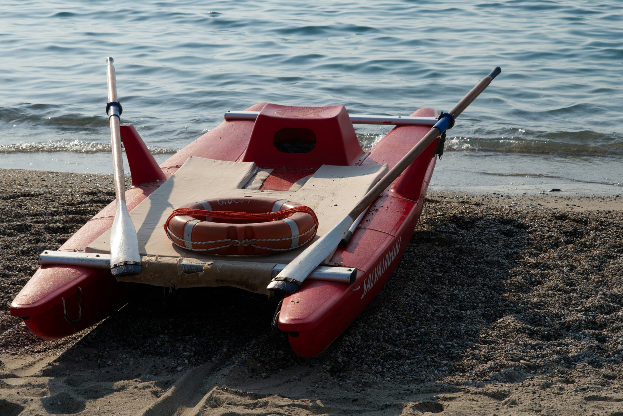 A rescue boat assisting another boat stranded in rough waters