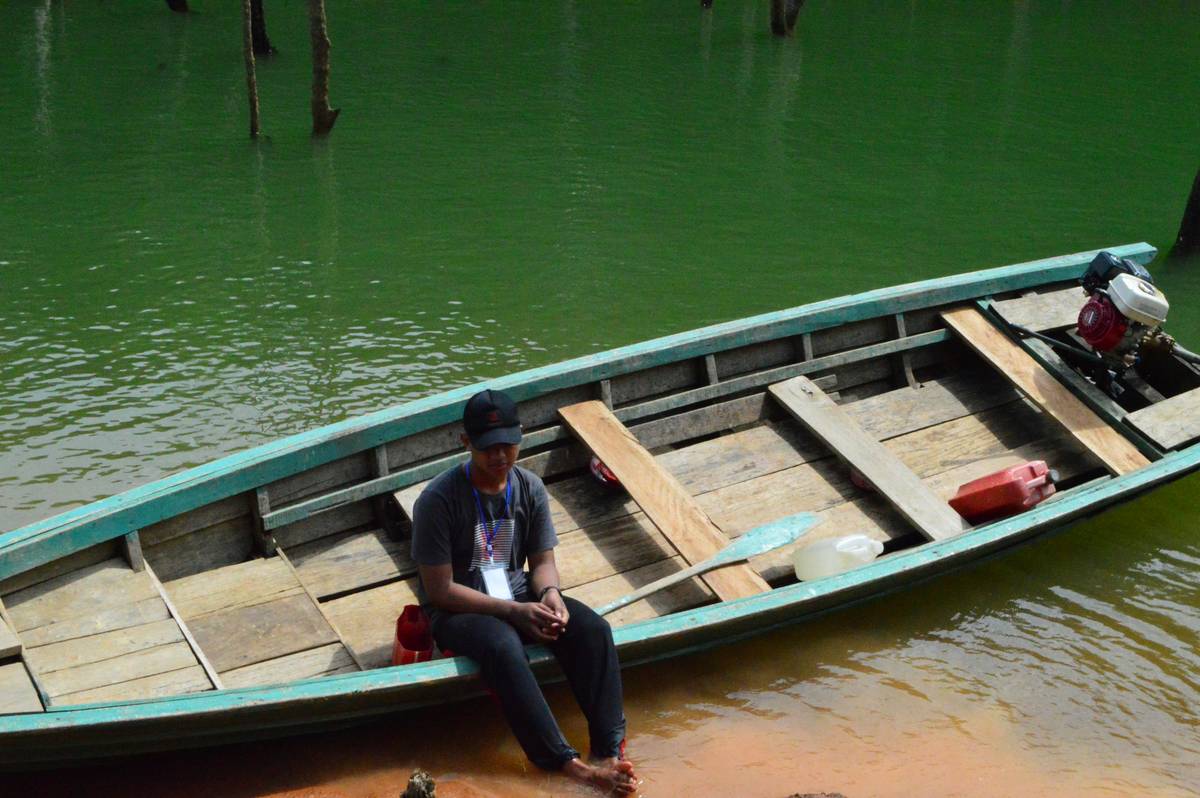 A serene lake reflecting mountains, perfect for peaceful boating trips