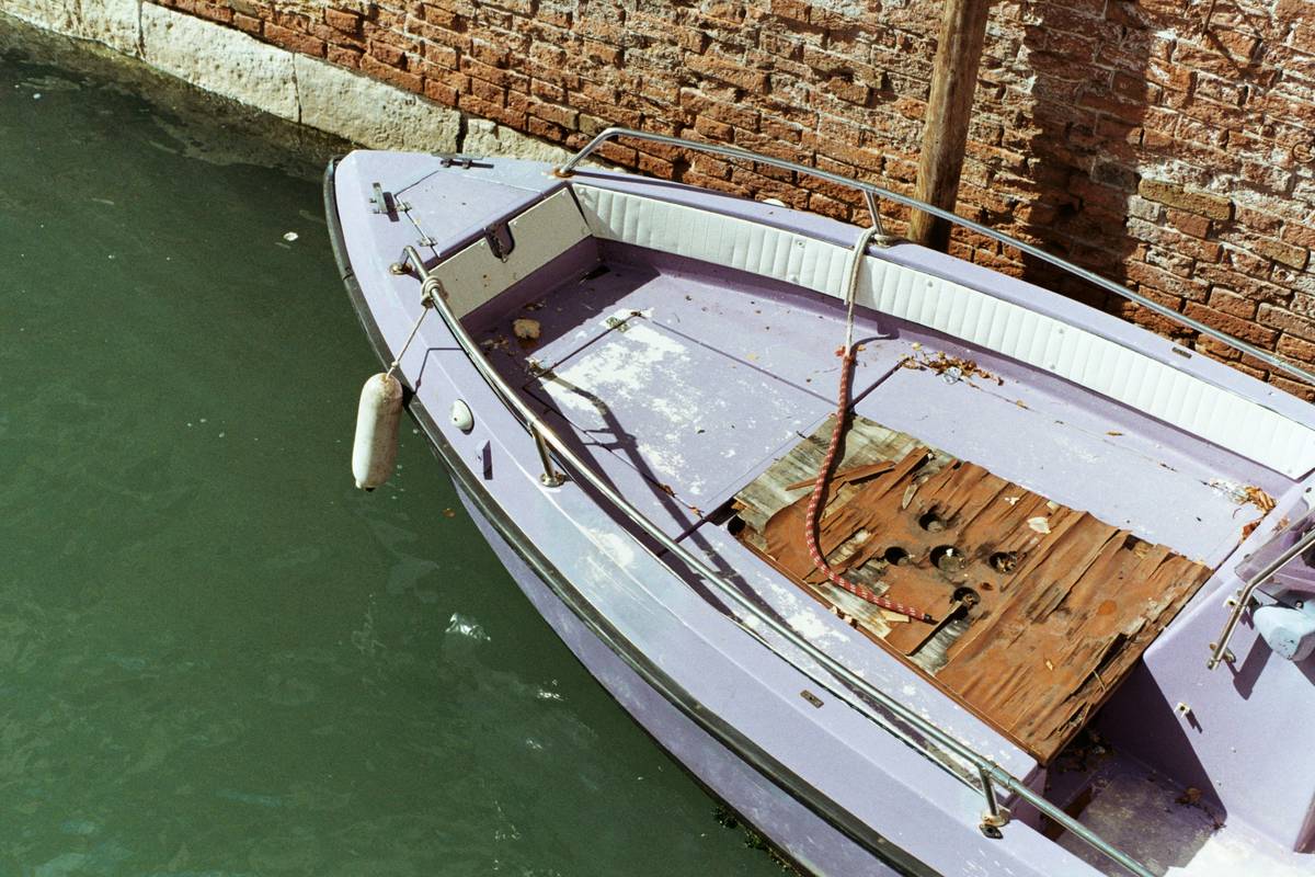Person inspecting a boat before renting
