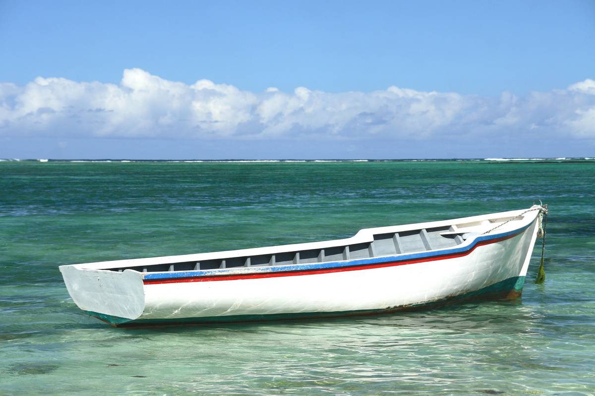 Smiling family enjoying their day at sea with insured rental boat